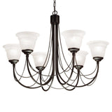 The Carisbrooke 6 Light Chandelier - Black features a black metal frame with frosted glass shades, giving it a vintage ambiance. Its gracefully curved arms contribute to its classic Gothic elegance, and the chandelier hangs from a chain, making it a timeless and stylish focal point.