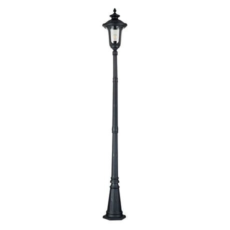 The Chicago Single Head Lamp Post - Black serves as an elegant outdoor fixture with its tall, vintage-inspired design. Featuring a single bulb encased in glass at the top, this aluminum street lamp showcases ornate decorative details on both the pole and base, encapsulating timeless charm.