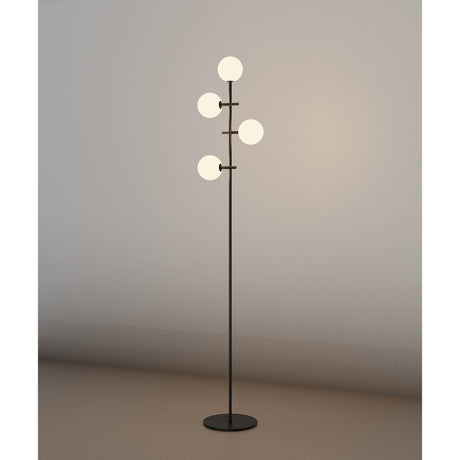 The Cellar LED Floor Lamp 5W 4000K - Black features four white glass globes at different heights on a sleek black stand, providing soft ambient lighting that enhances any plain wall.