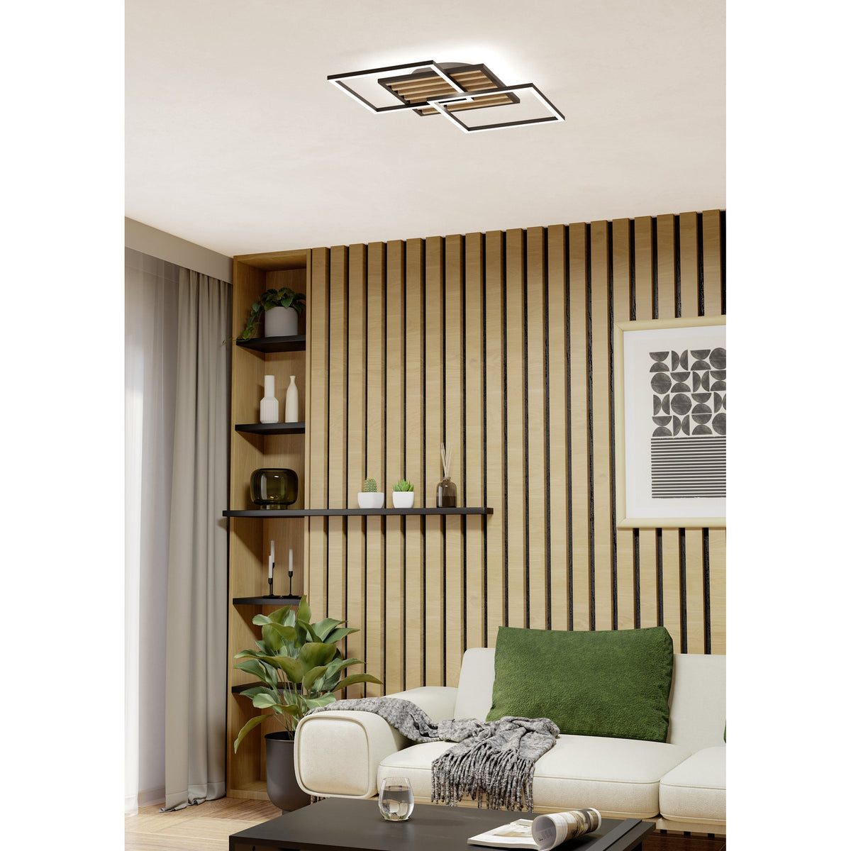 Cembrano 53cm square LED flush ceiling light with overlapping black frames and white edge diffusers, mounted above a wood-slat wall panel in a living room.