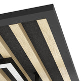 Close-up corner view of the Cembrano square LED flush ceiling light, showing black frame edges, natural wood slats, and black felt strips, with a white LED diffuser visible below.
