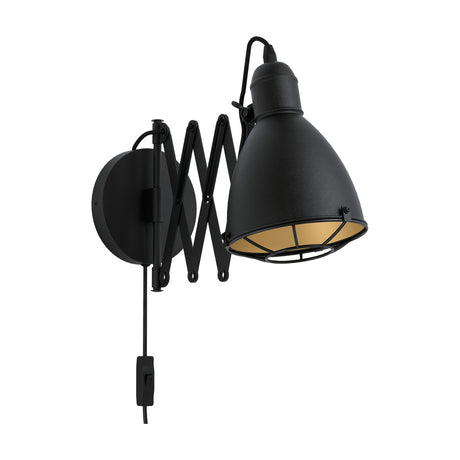 Cenvanne wall light with a black steel bell-shaped shade, gold interior lining, wire cage guard, scissor extending arm and round wall plate, shown on a plain white background.