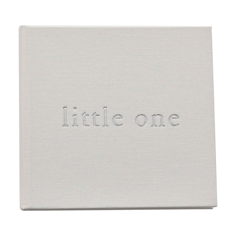 Square white linen baby photo album with woven texture and "little one" embossed in silver lettering on the cover, shown on a plain background.
