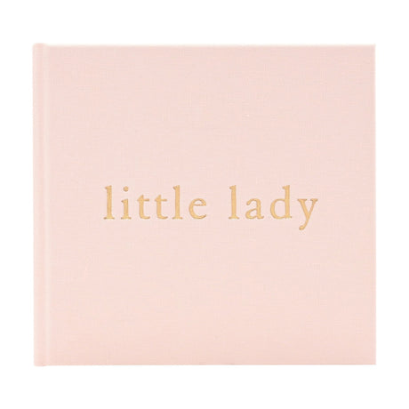 Square photo album with a soft pink woven linen cover, featuring "little lady" in gold lettering, shown on a plain white background.
