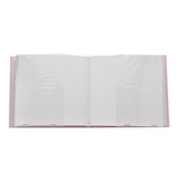 Pink photo album open to show clear slip-in plastic pockets for 6 x 4in portrait prints, with blank white pages on a plain background.