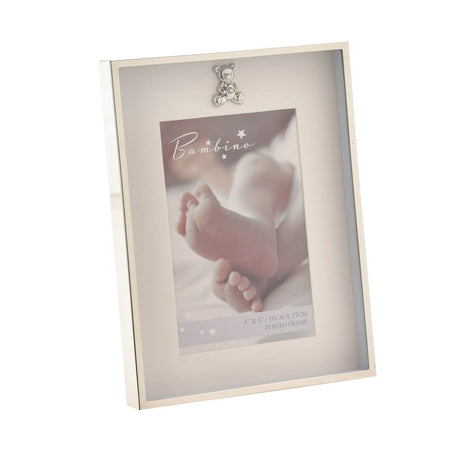 Silverplated rectangular photo frame with a thin silver border, cream mount, and small teddy bear detail above a 6 x 4in portrait photo, shown on a plain white background.