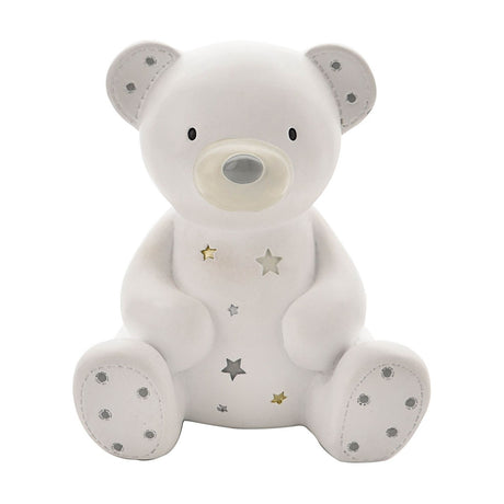 White resin sitting teddy bear money box with matt finish, grey-detailed ears and paws, and star cut-outs down its front, on a plain white background.