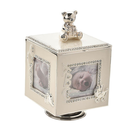 Square ivory and silver metal trinket box with a silverplated teddy bear on the lid, crystal-trimmed photo frame openings, and an ABC charm, shown on a plain background.