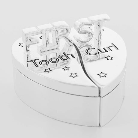 Heart-shaped silverplated keepsake box split into two lidded halves labelled "Tooth" and "Curl", with raised "FIRST" lettering and star details, on a white background.