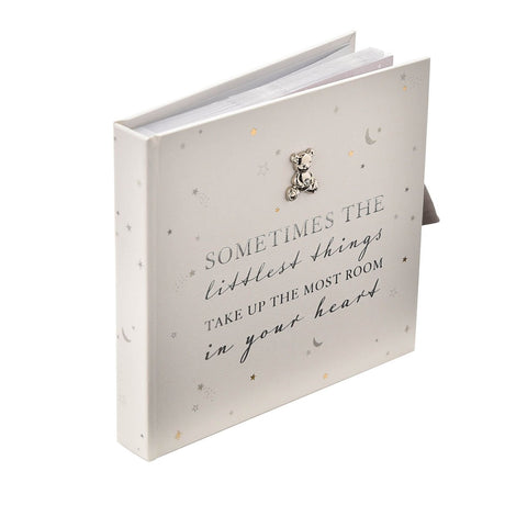 White square baby photo album with silver teddy bear charm, star and moon print, and foiled "Sometimes the littlest things" quote, for 50 6x4in prints.