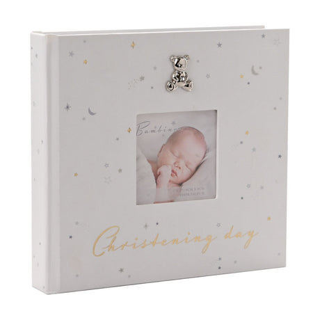 White Christening Day photo album for 50 prints, 6x4in, with star and moon print, silver-tone teddy bear charm, square photo window and gold script text.