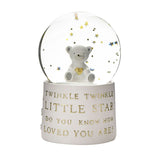 Teddy Bear Resin Water Globe Ornament with gold stars floating around a white teddy holding a gold heart, on a white base with gold "Twinkle Twinkle Little Star" text, plain background.