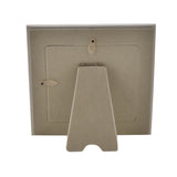Back view of the Baby Girl Teddy Resin Photo Frame, showing a square easel stand, hanging hooks and a metal clip strut on a neutral resin backing against a white background.