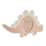 Stegosaurus-shaped MDF photo frame in soft pink with white spots, pale yellow back plates, and a round 3.5 x 3.5in photo window, shown on a white background.