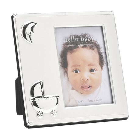 Square silver-plated photo frame with two-tone satin and polished finish, featuring raised crescent moon and pram icons, holding a 4 x 3in baby portrait on a white background.