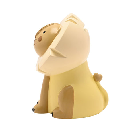 Sitting Lion Resin Money Box in yellow, side view showing cream mane, tan face with blush cheeks, black-tipped paws, and a curled tail ending in a heart, set against a plain white background.