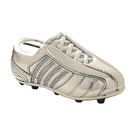 Silverplated metal football boot money box with laced tongue, stitched detailing, textured side stripes, and studded sole, shown on a plain white background.