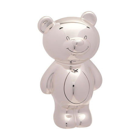 Silver plated teddy bear money box standing upright with round ears, button nose, smiling face, stitched neck detail, and oval tummy outline, shown on a plain white background.
