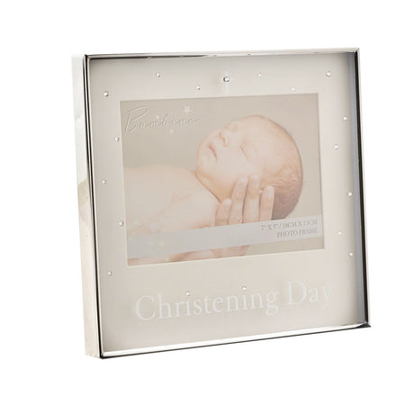 Silverplated 7 x 5in photo frame with cream mount, clear stone accents and a small cross, "Christening Day" text below, shown angled on a white background.