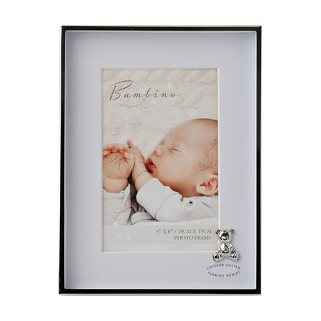 Rectangular photo frame with a silver-plated metal border and pale blue mount, holding a 6x4in portrait photo, with a small silver teddy bear detail at the lower corner.