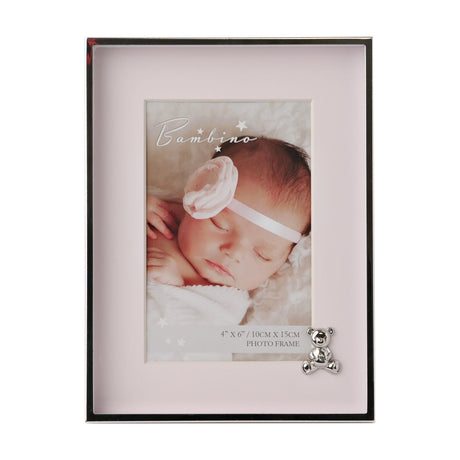 Rectangular silver-plated metal photo frame with pink mount for a 6 x 4in photo, featuring a small silver teddy bear accent at the lower corner, on a white background.