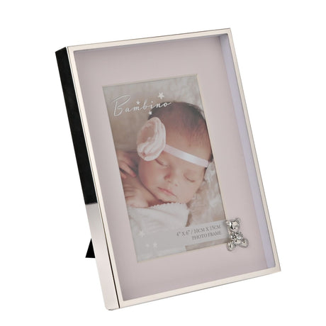 Silver-finish metal photo frame with pale pink mount, rectangular opening, and a small silver teddy bear detail at the lower corner, shown on a plain white background.