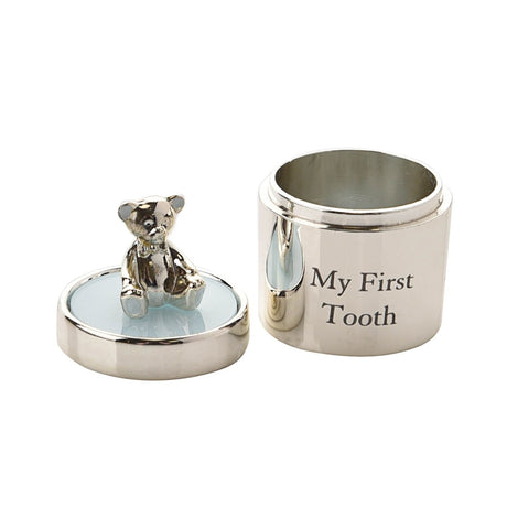 Round silverplated keepsake box engraved "My First Tooth" with lid open, showing a silver teddy bear on a pale blue lid top, set on a plain white background.
