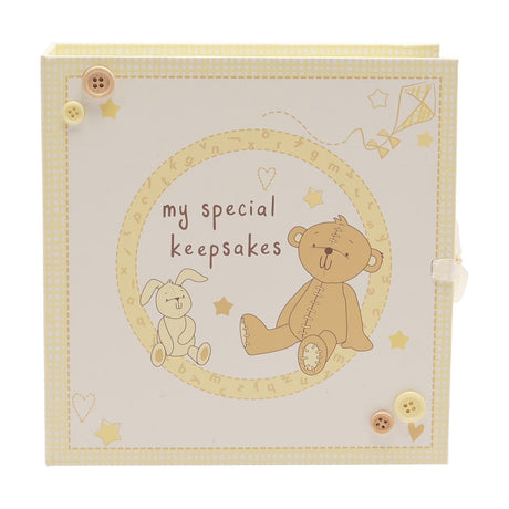 Cream book-style keepsake box featuring "my special keepsakes" title, a teddy bear and bunny inside a lettered circle, stars and kite details, and corner buttons, on a white background.