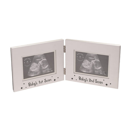 Double aluminium photo frame in silver, hinged with two windows captioned "Baby's 1st Scan" and "Baby's 2nd Scan" with star details, shown against a white background.