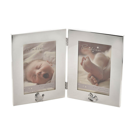 Hinged silverplated double photo frame with two 4x6in openings, polished borders, and pram and rocking horse motifs, shown open on a white background.