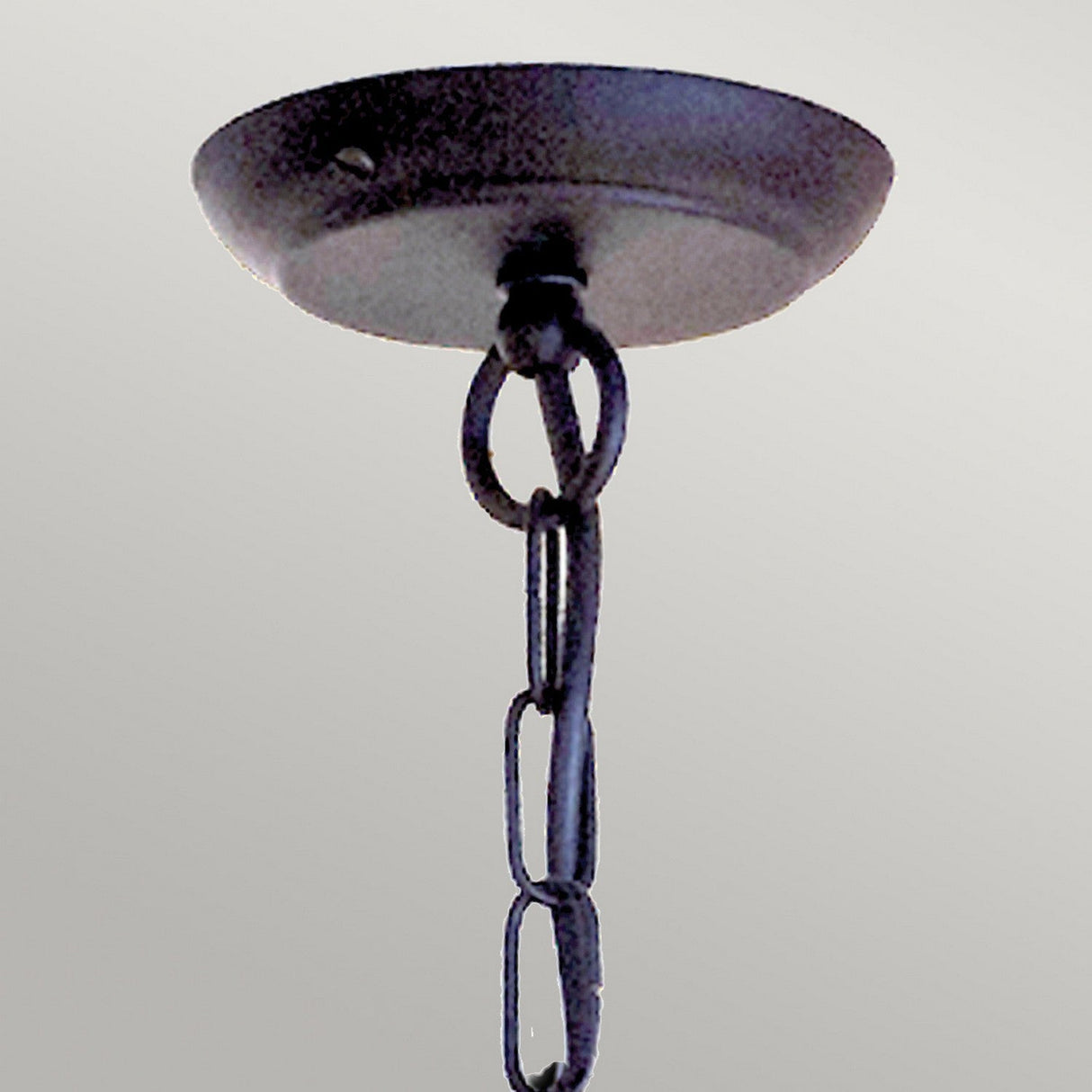 Close-up of the Chartwell 5 Light Chandelier in black, featuring a chain that exudes classic elegance, against a plain white background.