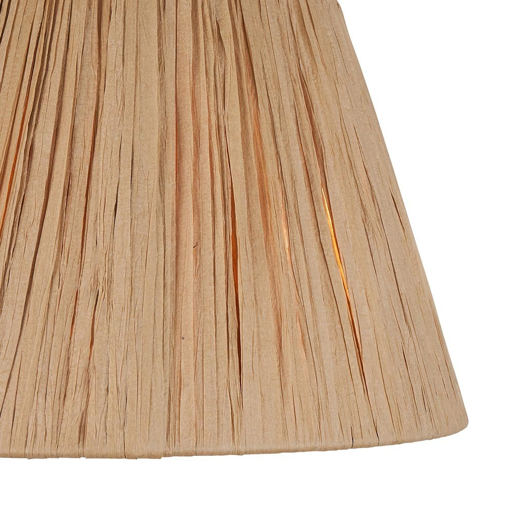 Close-up of the Endon Chartshaw 24cm tapered lamp shade showing its hand-wrapped natural raffia weave in a warm earthy tone.