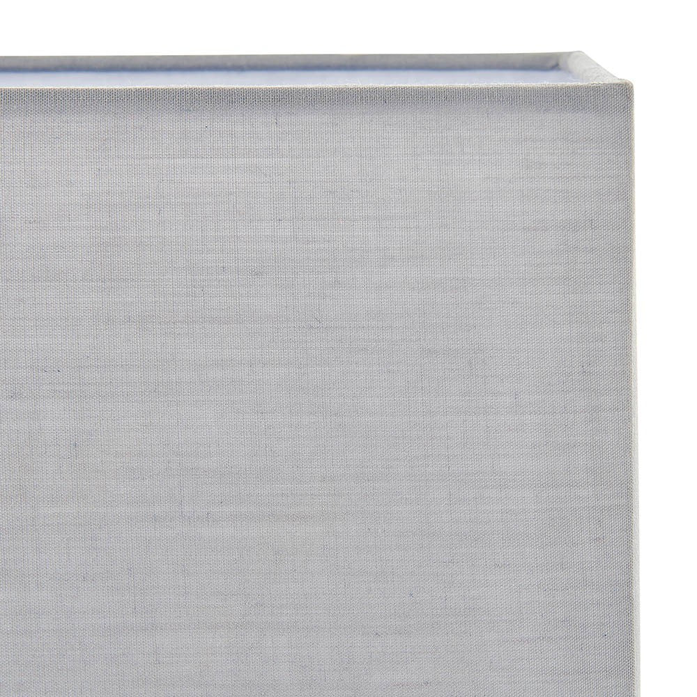 Close-up of the Chartstead rectangular tapered lamp shade in grey cotton fabric, showing the rolled edge and tailored corner seam against a plain background.