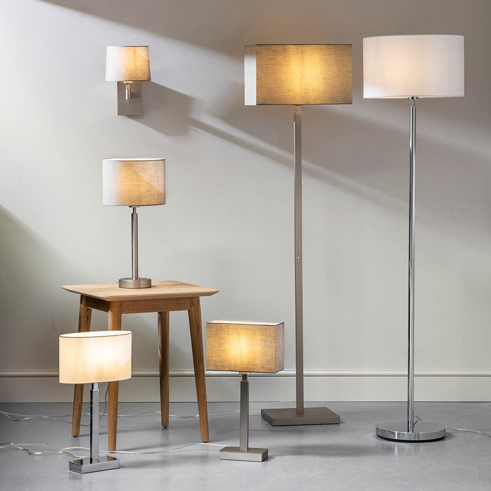Chartstead rectangular 27cm grey fabric lamp shade shown on floor and table lamps in a neutral room setting.