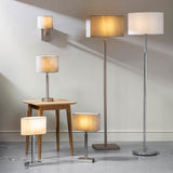 Chartstead rectangular 27cm grey fabric lamp shade shown on floor and table lamps in a neutral room setting.