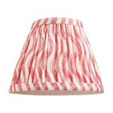 Endon Chartwood 16cm tapered lamp shade in coral pink and white pleated faux linen with a rippled wave print and taped edges, on a white background.