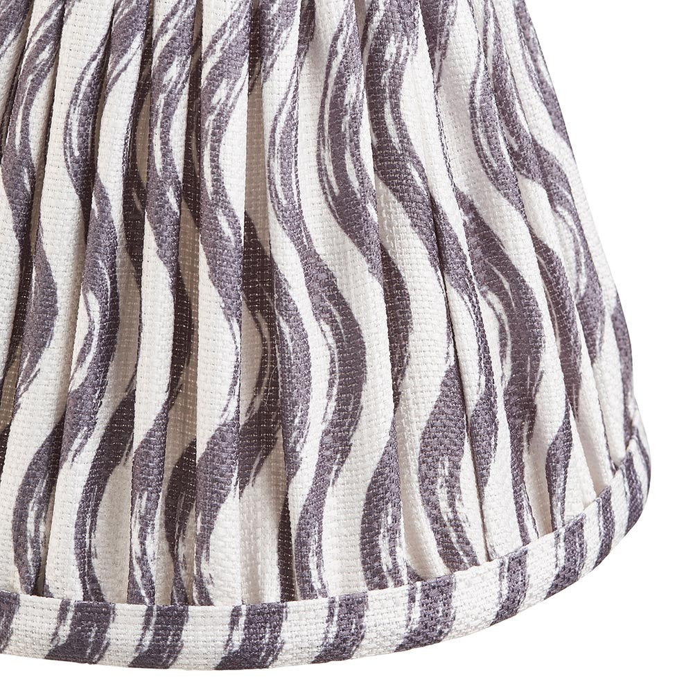 Close-up of Endon Chartwood 16cm tapered lamp shade in pearl grey pleated faux linen with a soft ripple print and taped edge trim.