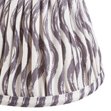 Close-up of Endon Chartwood 16cm tapered lamp shade in pearl grey pleated faux linen with a soft ripple print and taped edge trim.