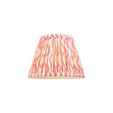 Endon Chartwood 20cm tapered lamp shade in coral pink and white pleated faux linen with a ripple print and taped edging, on a plain background.