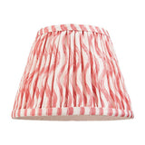 Endon Chartwood 20cm tapered lamp shade in pleated faux linen with a coral pink and white ripple print and taped edges, on a plain background.