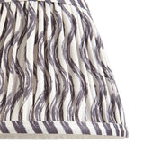 Close-up of the Endon Chartwood 20cm tapered lamp shade in pearl grey, showing pleated faux linen with a soft grey and white ripple print.