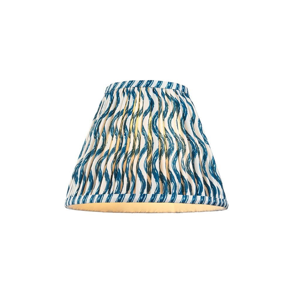 Endon Chartwood 25cm tapered lamp shade in marlin blue and white pleated faux linen with a ripple print and taped edges, on a plain background.