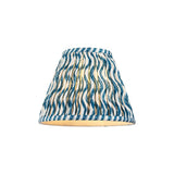 Endon Chartwood 25cm tapered lamp shade in marlin blue and white pleated faux linen with a ripple print and taped edges, on a plain background.