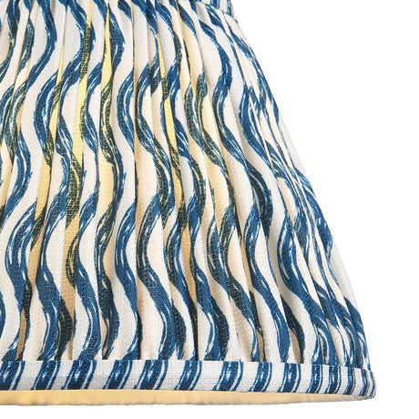 Endon Chartwood 25cm tapered lamp shade in marlin blue, close-up of the pleated faux linen with a blue ripple print on white and taped edging.