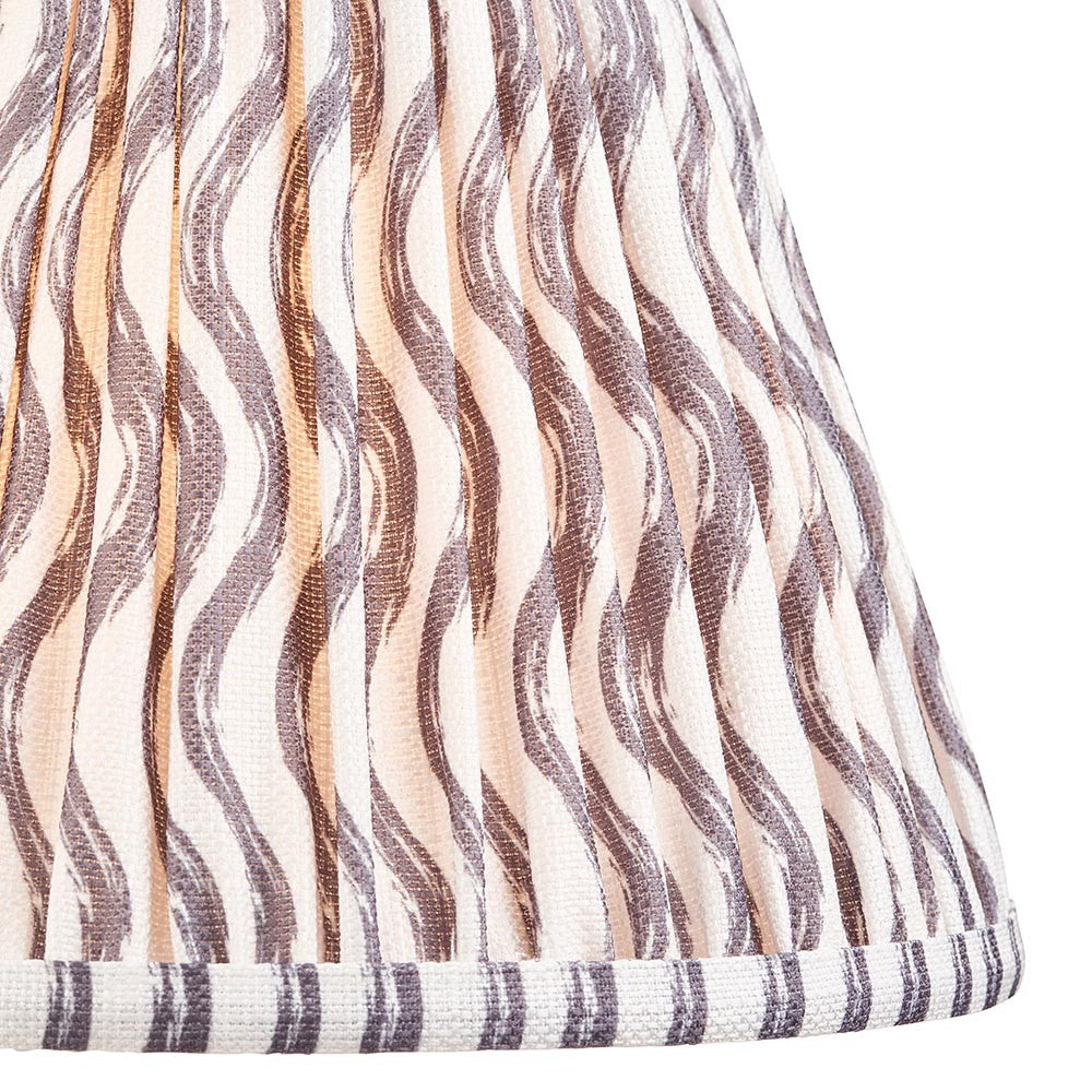 Close-up of Endon Chartwood 25cm tapered lamp shade in pearl grey pleated faux linen with a soft grey ripple print and taped edge detailing.