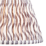 Close-up of Endon Chartwood 25cm tapered lamp shade in pearl grey pleated faux linen with a soft grey ripple print and taped edge detailing.