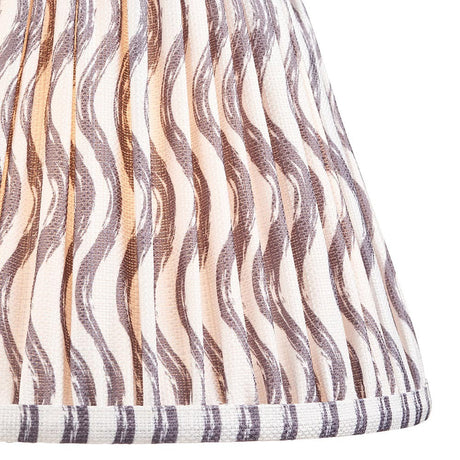 Close-up of Endon Chartwood 25cm tapered lamp shade in pearl grey pleated faux linen with a soft grey ripple print and taped edge detailing.
