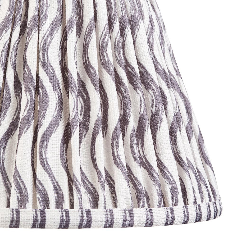 Close-up of the Endon Chartwood 25cm tapered lamp shade in pearl grey, showing pleated faux linen with a soft grey ripple print and taped edge trim.