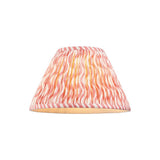 Endon Chartwood 30cm tapered lamp shade in pleated coral pink and white faux linen with a rippled print and taped edges, on a plain background.