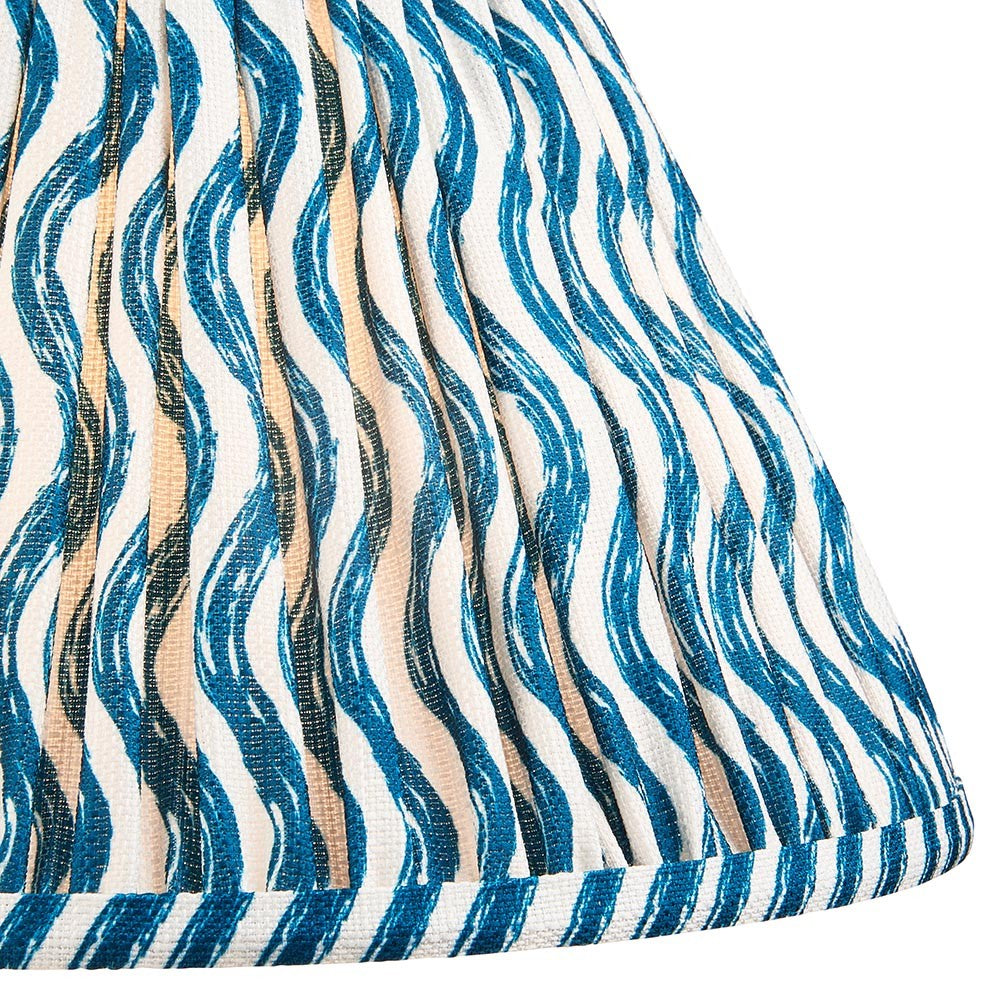 Close-up of the Endon Chartwood 30cm tapered lamp shade in Marlin Blue, showing pleated faux linen with a rippled blue and white print and taped edge.